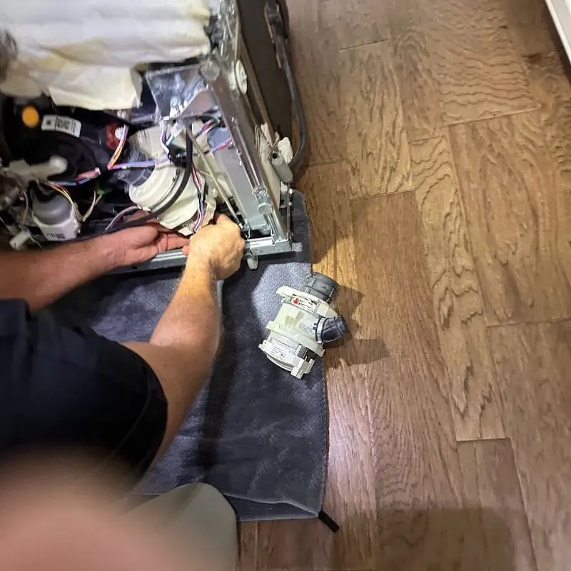 PowerOn Appliance Repair Service technician replacing thermador dishwasher circulating pump in The Woodlands, TX.