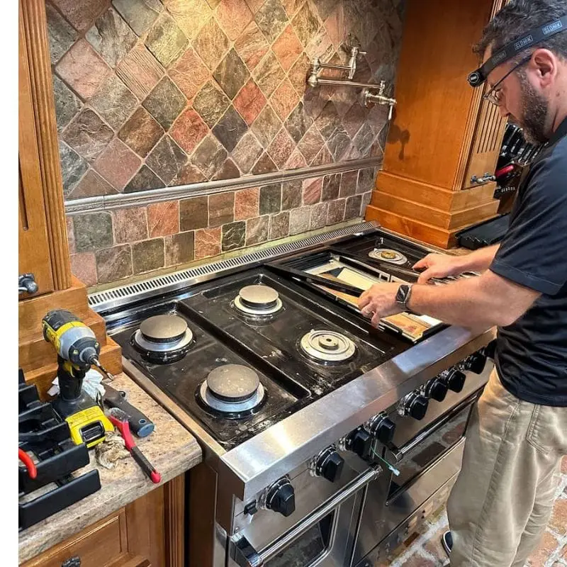 PowerOn Appliance Repair Service technician servicing Viking Range in The Woodlands, TX.