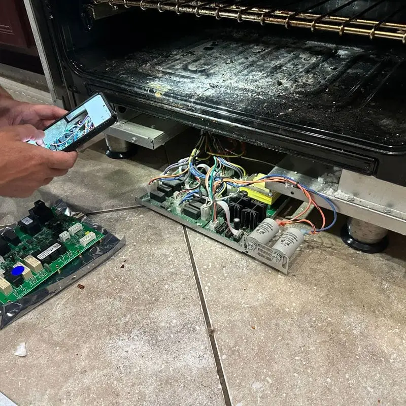 PowerOn Appliance Repair Service technician servicing JennAir Range in The Woodlands, TX.