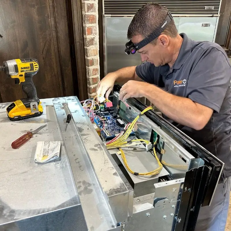 PowerOn Appliance Repair Service technician servicing Bosch wall oven in The Woodlands, TX.