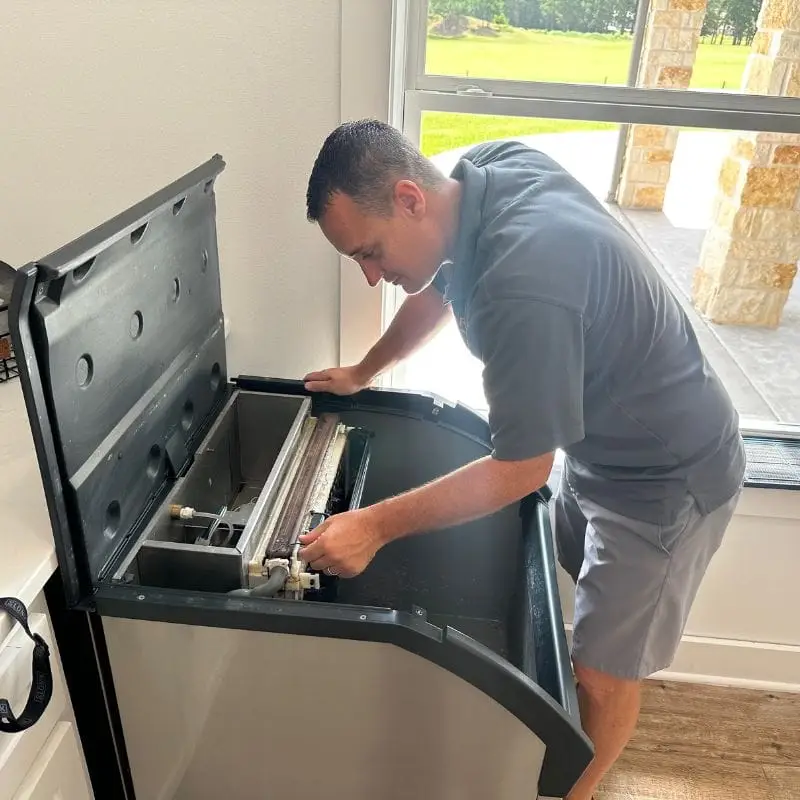 PowerOn Appliance Repair Service technician servicing Scotsman commercial ice machine in Willis, TX.