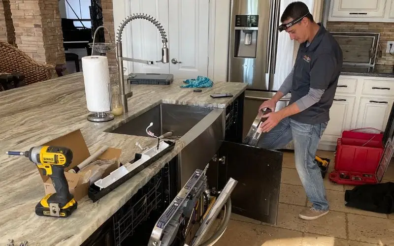 PowerOn Appliance Repair Service technician servicing dishwasher in the woodlands tx