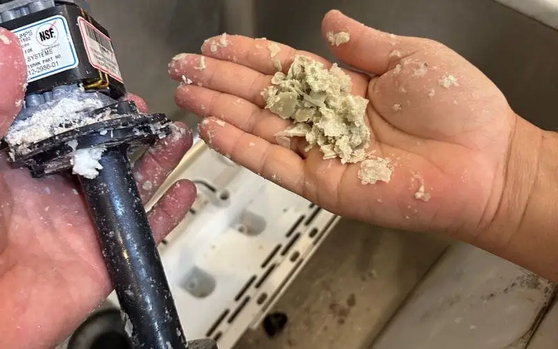 PowerOn Appliance Repair Service technician cleaning scotsman ice machine