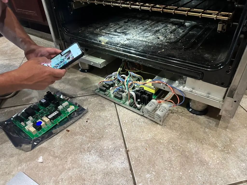 PowerOn Appliance Repair Service technician servicing electric range