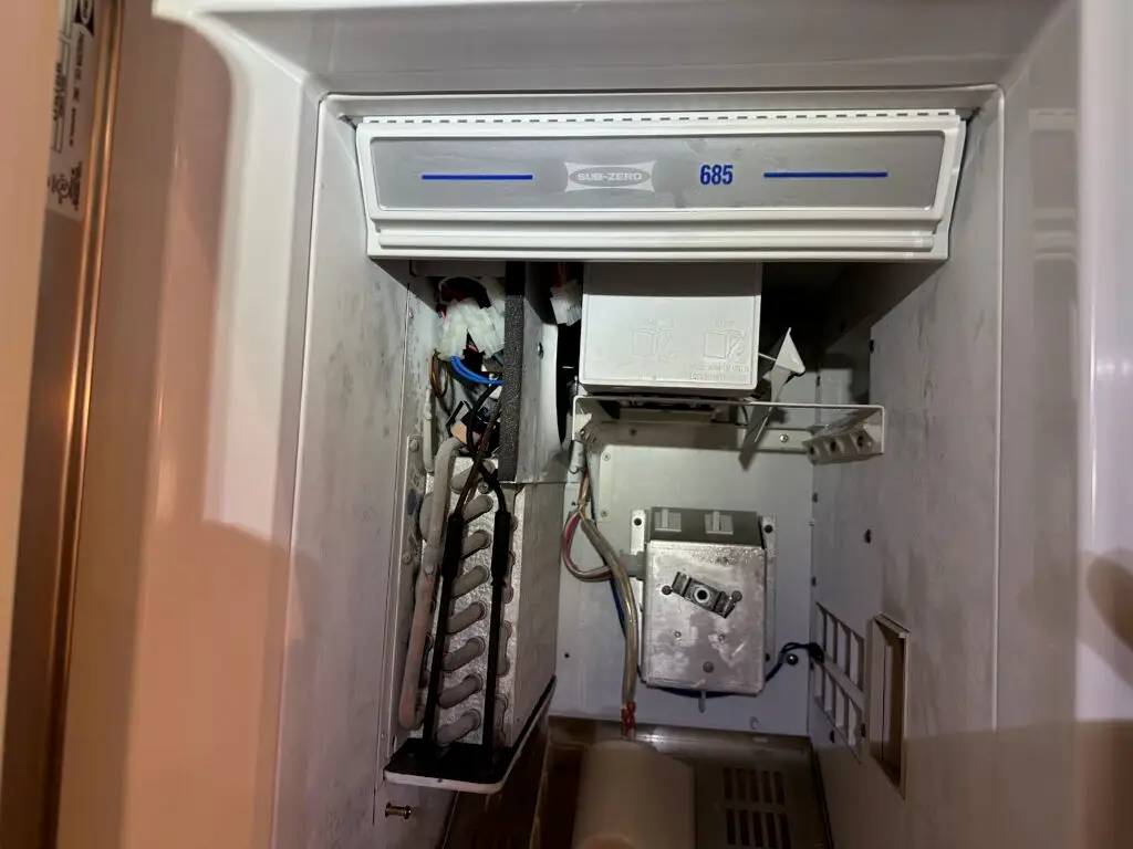 PowerOn Appliance Repair Service technician servicing Sub-Zero freezer iN the Woodlands, TX.