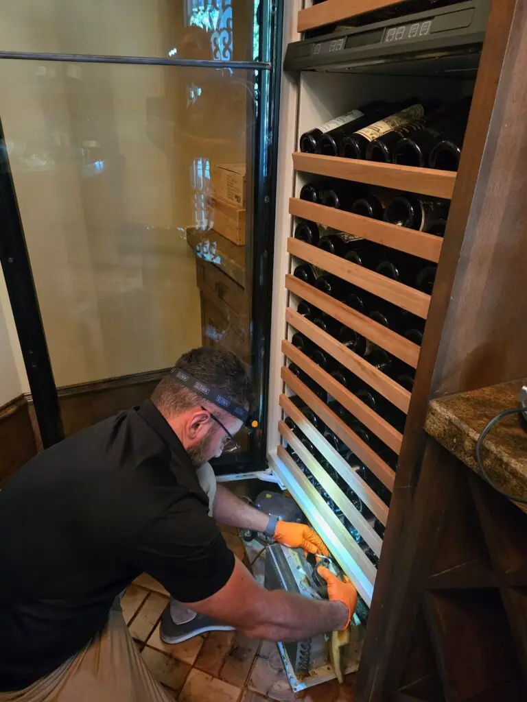 PowerOn Appliance Repair Service technician working on Sub-Zero Wine cooler in The Woodlands, TX.