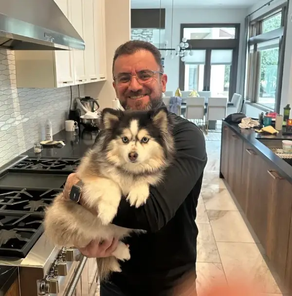 PowerOn Appliance Repair Service technician with customer pet in The Woodlands, TX
