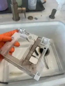 KitchenAid ice machine pump holder before cleaning