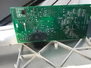 Failed washing machine control board damaged by a shorted drain pump