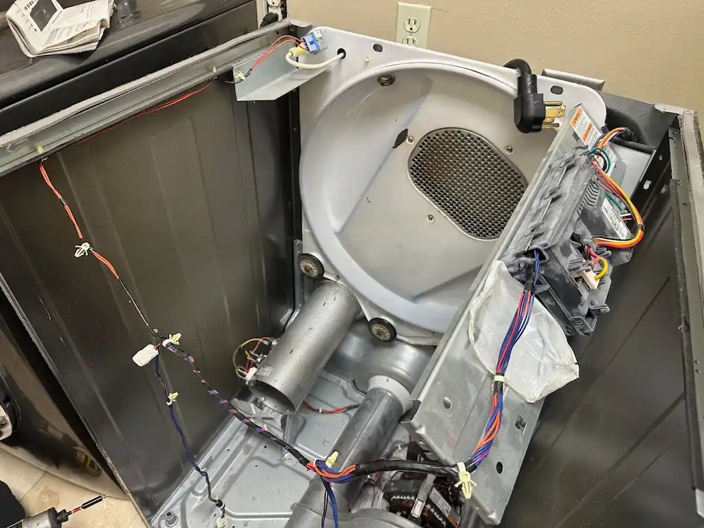 Electrolux dryer control board and internal wiring exposed during a no-heat diagnostic in The Woodlands
